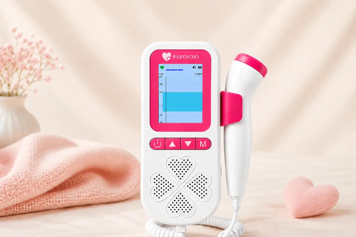 Pink-and-white Babyecho Fetal Doppler Pro in a soft nursery setting