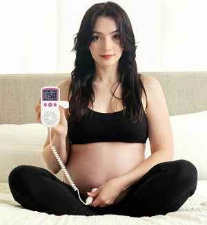 Pregnant mom listening to baby heartbeat with BabyEcho fetal doppler